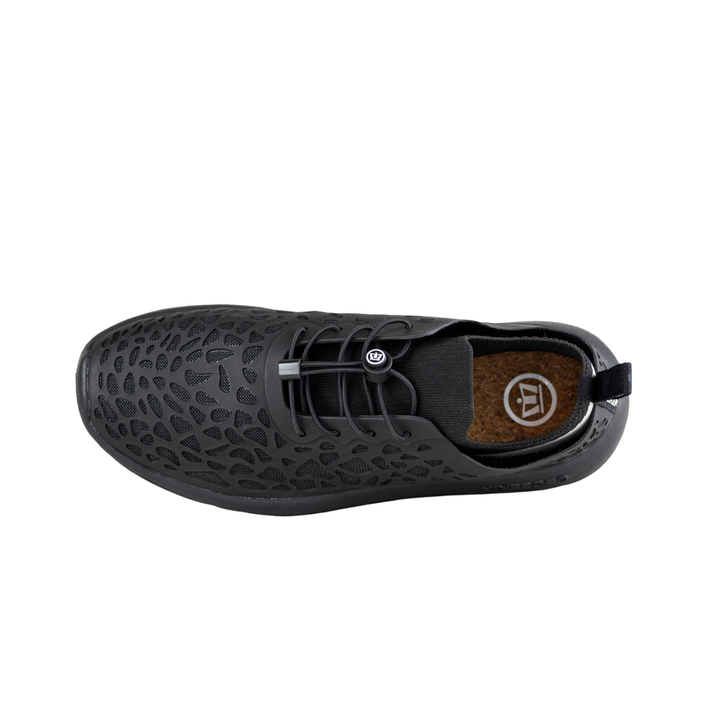 Crosskix Tetra Night shoe top view showing perforated black upper, lace-up closure, and brown cork insole with Crosskix logo